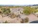 One-story house with tile roof, desert landscaping, and a two-car garage at 32032 N 52Nd Way, Cave Creek, AZ 85331