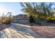 Single story home with a three-car garage and desert landscaping at 32032 N 52Nd Way, Cave Creek, AZ 85331