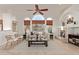 Cozy living room with fireplace and large windows at 32032 N 52Nd Way, Cave Creek, AZ 85331