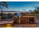 Built-in outdoor kitchen with grill and refrigerator at 32032 N 52Nd Way, Cave Creek, AZ 85331