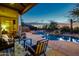 Relaxing pool area with patio furniture and stunning sunset views at 32032 N 52Nd Way, Cave Creek, AZ 85331