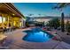 Inviting pool and spa at sunset with desert landscape at 32032 N 52Nd Way, Cave Creek, AZ 85331