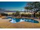 Inviting pool with a waterfall feature and desert landscaping at 32032 N 52Nd Way, Cave Creek, AZ 85331