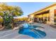 Relaxing pool and spa with surrounding landscaping at 32032 N 52Nd Way, Cave Creek, AZ 85331