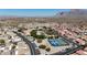 Aerial view of community with pool and tennis courts at 3301 S Goldfield Rd # 4086, Apache Junction, AZ 85119