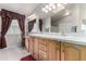 Bathroom with double vanity and large mirror at 3301 S Goldfield Rd # 4086, Apache Junction, AZ 85119