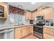 Modern kitchen with stainless steel appliances at 3301 S Goldfield Rd # 4086, Apache Junction, AZ 85119