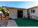 Small patio with table and chairs, artificial turf at 3301 S Goldfield Rd # 4086, Apache Junction, AZ 85119