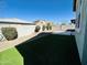 Artificial turf and gravel landscaping in backyard at 3448 E Spring Wheat Ln, Gilbert, AZ 85296