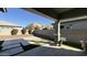 View of backyard with covered patio and artificial turf at 3448 E Spring Wheat Ln, Gilbert, AZ 85296