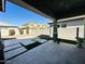 View of backyard with covered patio and artificial turf at 3448 E Spring Wheat Ln, Gilbert, AZ 85296