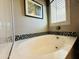 Elegant bathroom with soaking tub, tile shower, and modern vanity at 3448 E Spring Wheat Ln, Gilbert, AZ 85296