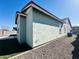 House exterior showcasing light green walls and gravel landscaping at 3448 E Spring Wheat Ln, Gilbert, AZ 85296