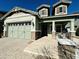 Two story light sage home with a three car garage at 3448 E Spring Wheat Ln, Gilbert, AZ 85296