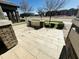 Front patio with stone tile flooring and brick columns at 3448 E Spring Wheat Ln, Gilbert, AZ 85296