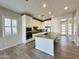 Modern kitchen with island, stainless steel appliances, and white cabinets at 3448 E Spring Wheat Ln, Gilbert, AZ 85296