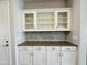 White shaker cabinets and gray quartz countertops in kitchen at 3448 E Spring Wheat Ln, Gilbert, AZ 85296