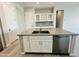 Kitchen island with sink, dishwasher, and ample counter space at 3448 E Spring Wheat Ln, Gilbert, AZ 85296