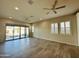 Spacious living area with tile flooring and ceiling fans at 3448 E Spring Wheat Ln, Gilbert, AZ 85296