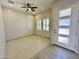 Light and airy living room with tile flooring and neutral walls at 3448 E Spring Wheat Ln, Gilbert, AZ 85296