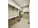 Spacious walk-in closet with ample shelving and hanging space at 3448 E Spring Wheat Ln, Gilbert, AZ 85296