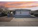 Gray house with two-car garage and landscaped front yard at 3519 E Red Oak Ln, Gilbert, AZ 85297