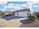 Gray house with a two-car garage and a landscaped yard at 3519 E Red Oak Ln, Gilbert, AZ 85297