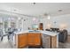 Eat-in kitchen featuring an island, stainless steel appliances, and wood cabinetry at 3519 E Red Oak Ln, Gilbert, AZ 85297