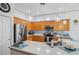 Modern kitchen with stainless steel appliances and light wood cabinets at 3519 E Red Oak Ln, Gilbert, AZ 85297