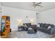 Comfortable living room with sectional sofa, hardwood floors and ceiling fan at 3519 E Red Oak Ln, Gilbert, AZ 85297