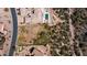 Aerial view of a vacant lot, next to homes with pools, in a mountainside community at 4215 S Willow Springs Trl, Gold Canyon, AZ 85118