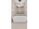 Luxurious bathroom featuring a modern soaking tub and a glass-enclosed shower with dual showerheads at 4215 S Willow Springs Trl, Gold Canyon, AZ 85118
