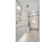 Modern bathroom with a glass shower, cream vanity with gold fixtures and large mirror, and a toilet at 4215 S Willow Springs Trl, Gold Canyon, AZ 85118