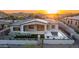 Stunning single-story home with desert landscaping, a modern pool, and a built-in outdoor kitchen at 4215 S Willow Springs Trl, Gold Canyon, AZ 85118