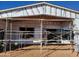 Rear exterior of under construction home; scaffolding and insulation visible at 4215 S Willow Springs Trl, Gold Canyon, AZ 85118