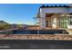 New house under construction with pool, showcasing modern design and desert landscaping at 4215 S Willow Springs Trl, Gold Canyon, AZ 85118