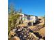 New house under construction, showcasing the exterior walls and landscaping at 4215 S Willow Springs Trl, Gold Canyon, AZ 85118