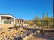 New house under construction, showcasing the exterior walls and landscaping at 4215 S Willow Springs Trl, Gold Canyon, AZ 85118