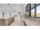 Modern kitchen featuring a large island, sleek countertops, and stylish fixtures, with an open view into a spacious living area at 4215 S Willow Springs Trl, Gold Canyon, AZ 85118