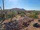 Landscaping under construction; desert landscape, rock work and mountain view at 4215 S Willow Springs Trl, Gold Canyon, AZ 85118