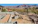 Landscaping under construction; retaining wall, mountain view in background at 4215 S Willow Springs Trl, Gold Canyon, AZ 85118