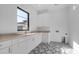 Laundry room with sleek countertops and bold tile floor at 4215 S Willow Springs Trl, Gold Canyon, AZ 85118
