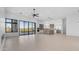 Expansive living area with sliding glass doors to backyard, modern kitchen and mountain views at 4215 S Willow Springs Trl, Gold Canyon, AZ 85118