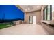 Luxury covered patio boasts a built-in grill, stone accents, and picturesque desert views for premier outdoor entertainment at 4215 S Willow Springs Trl, Gold Canyon, AZ 85118