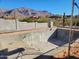 Under construction pool; concrete structure, mountain views in background at 4215 S Willow Springs Trl, Gold Canyon, AZ 85118