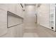 Modern shower showcasing gray tiling, a built-in bench, and a niche for storage next to the glass enclosure at 4215 S Willow Springs Trl, Gold Canyon, AZ 85118
