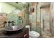 Charming bathroom with a unique sink and slate tile at 4430 E Graythorn St, Phoenix, AZ 85044