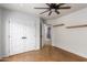 Spacious bedroom with double doors and cork flooring at 4430 E Graythorn St, Phoenix, AZ 85044