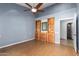 Bedroom with built-in shelves and ensuite bathroom at 4430 E Graythorn St, Phoenix, AZ 85044