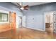 Bedroom with built-in shelves and ceiling fan at 4430 E Graythorn St, Phoenix, AZ 85044